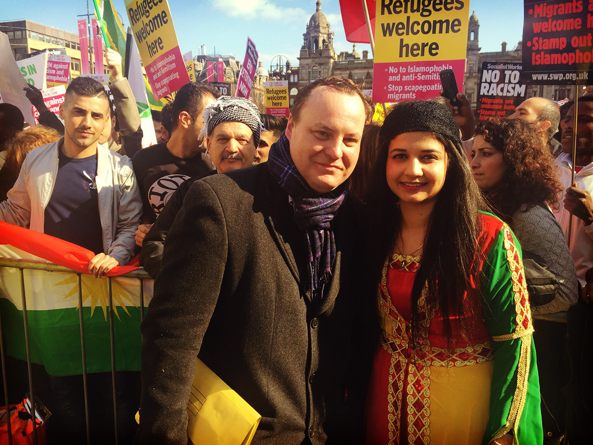Chris Stephens MP and Cllr Roza Salih in George Sq at a refugees welcome demonstration.